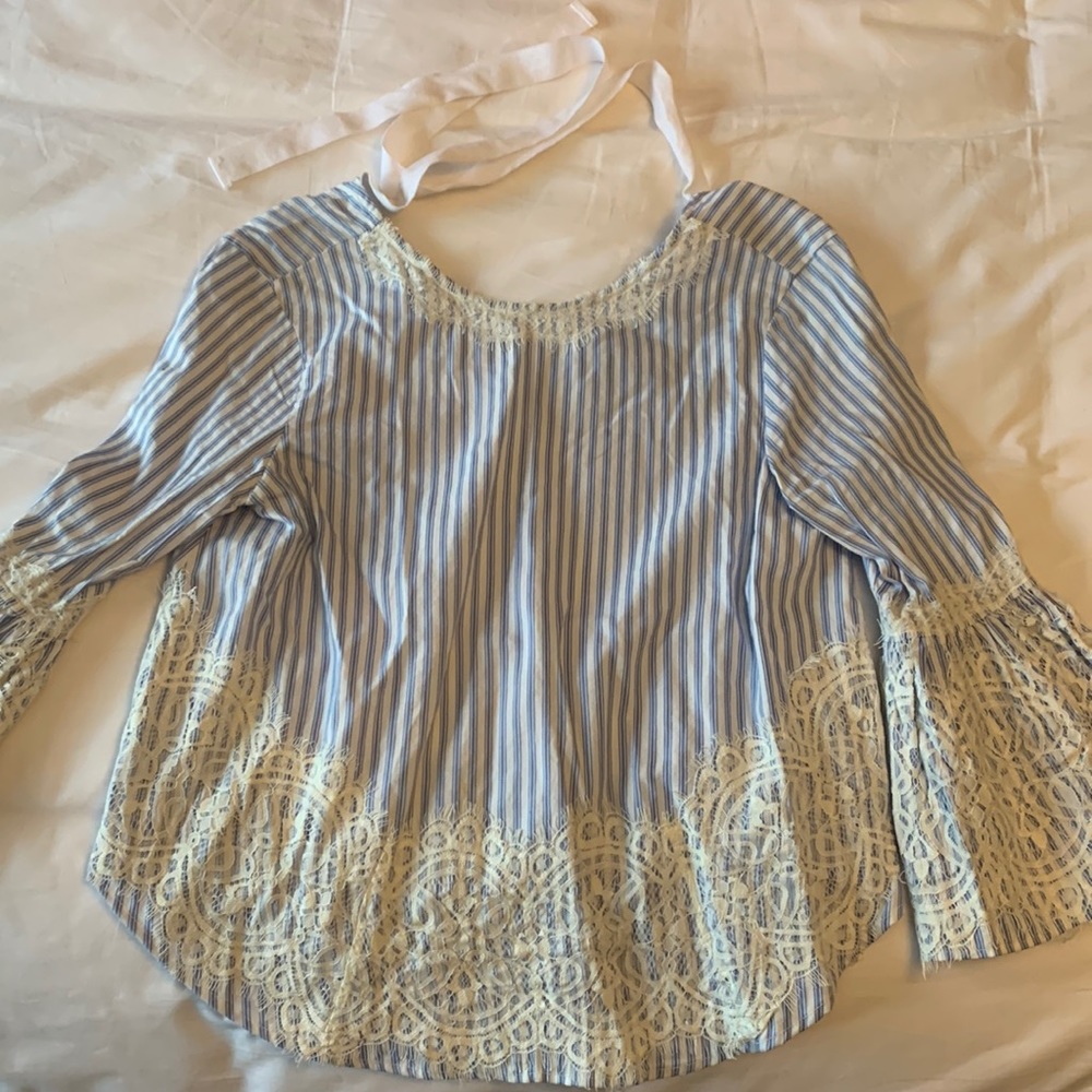 Bought in Italy at Zara store. Flattering and chic. Ties in back at neck
